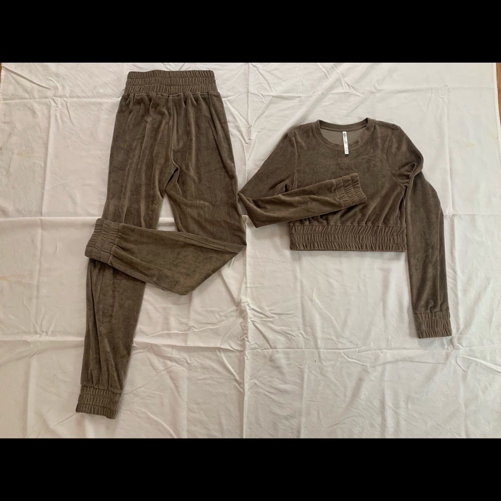 Ricki Brazil: Two Piece Crew Neck Pullover and Jogger pants.
